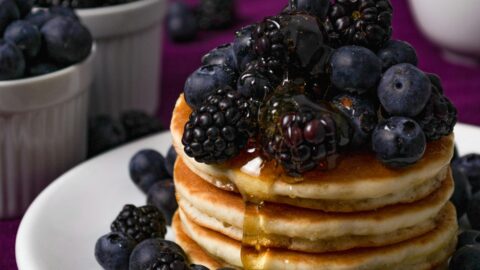 Pancakes with blueberries and blackberries.